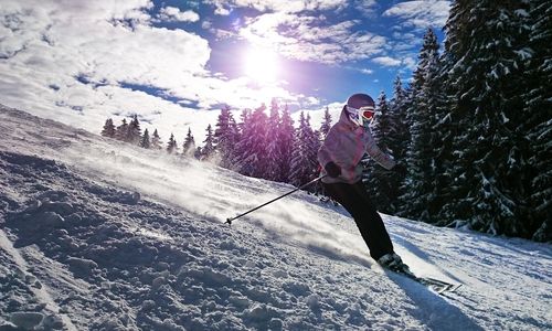 Skier ascending mountain